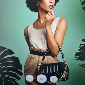 Think roylyn bar bag nwot pearl black with gold and short black strap